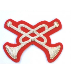 Crossed Trumpets on Scarlet
